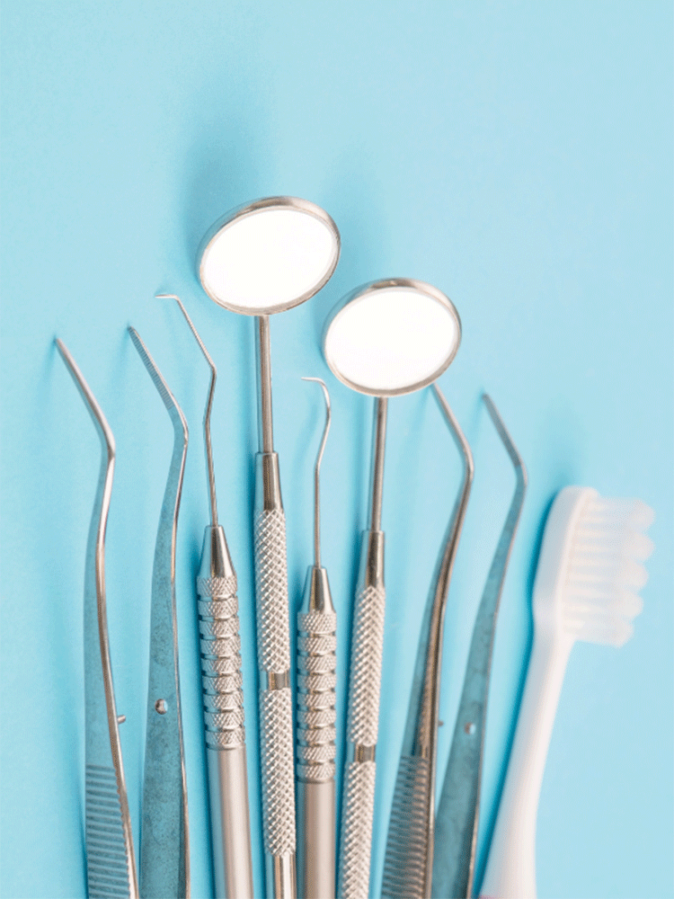 dental tools with a light blue background