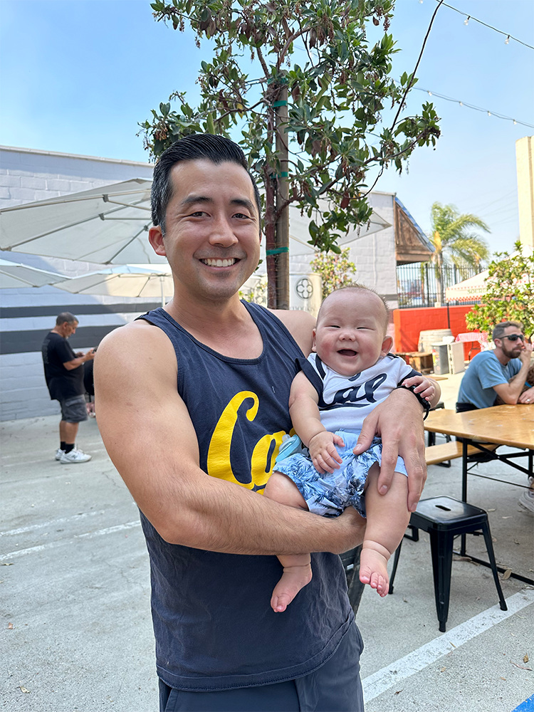Dr. Kyle Nishimura holding his son