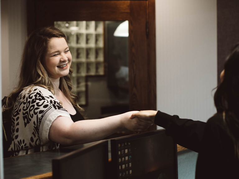 image of a girl shaking hands with another woman